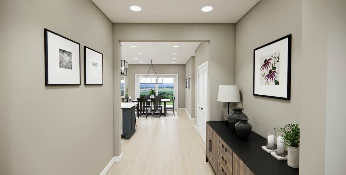 Greige Hallway With Framed Art and a Console That Sets the Tone Early
