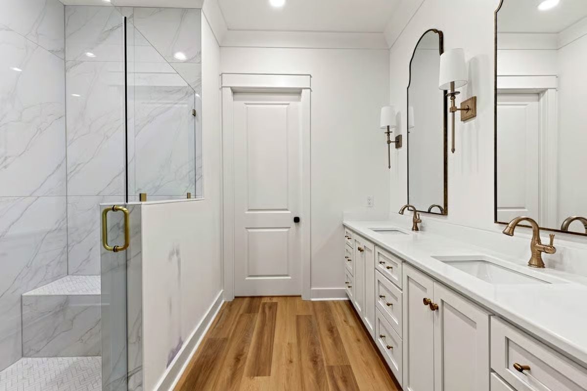 Gold Hardware on White Cabinetry That Runs the Entire Length of the Wall