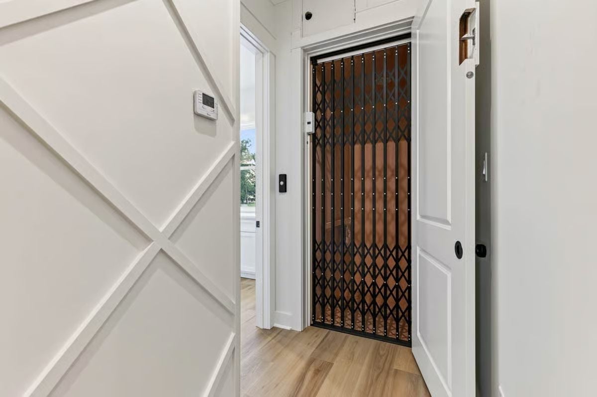 Scissor-Gate Elevator Tucked Into a Hallway That Earns Its Square Footage