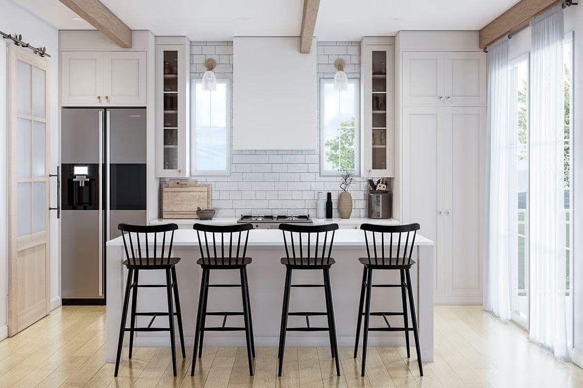 Black Windsor Barstools Do the Heavy Lifting in This Soft White Kitchen