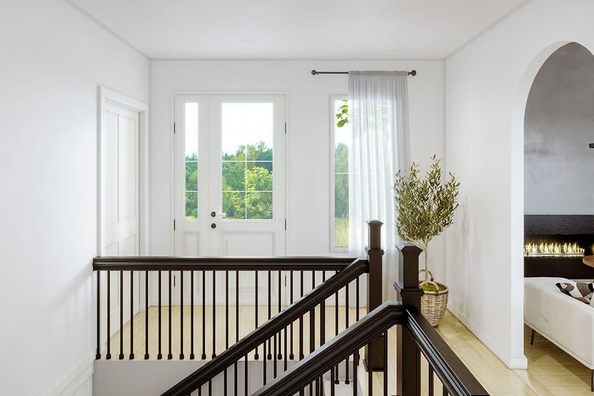 Dark Handrails Against White Walls at the Top of the Stairs