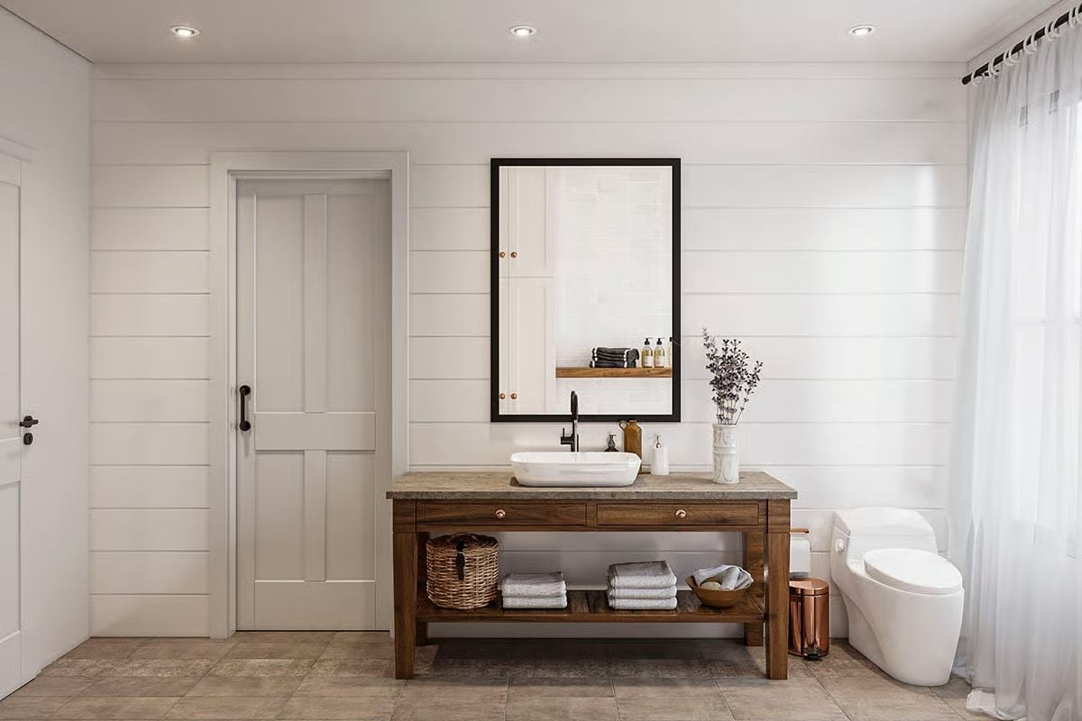 Shiplap Walls and a Freestanding Wood Vanity Give This Bathroom Its Backbone