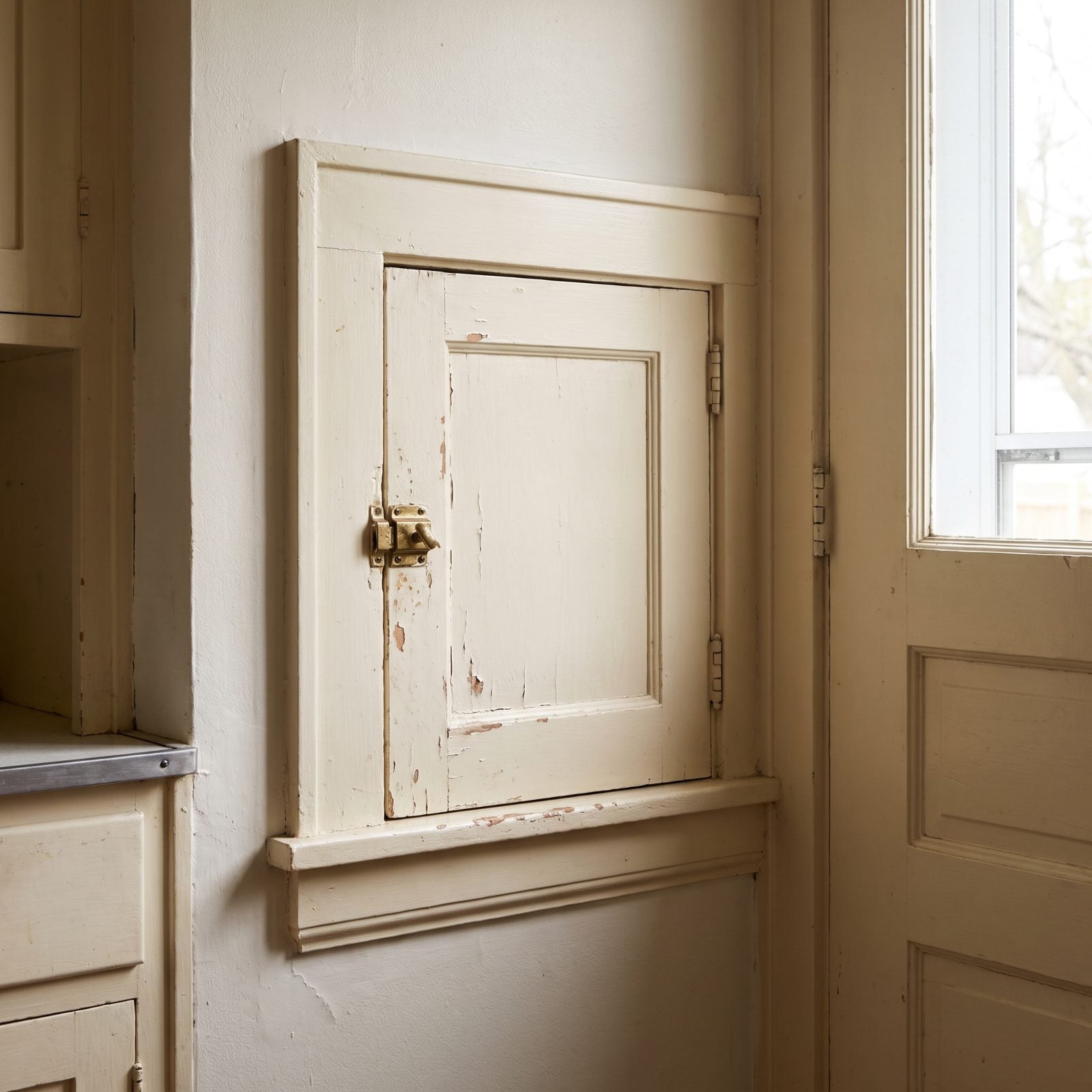 A Milk-Delivery Door Set Into the Kitchen Wall
