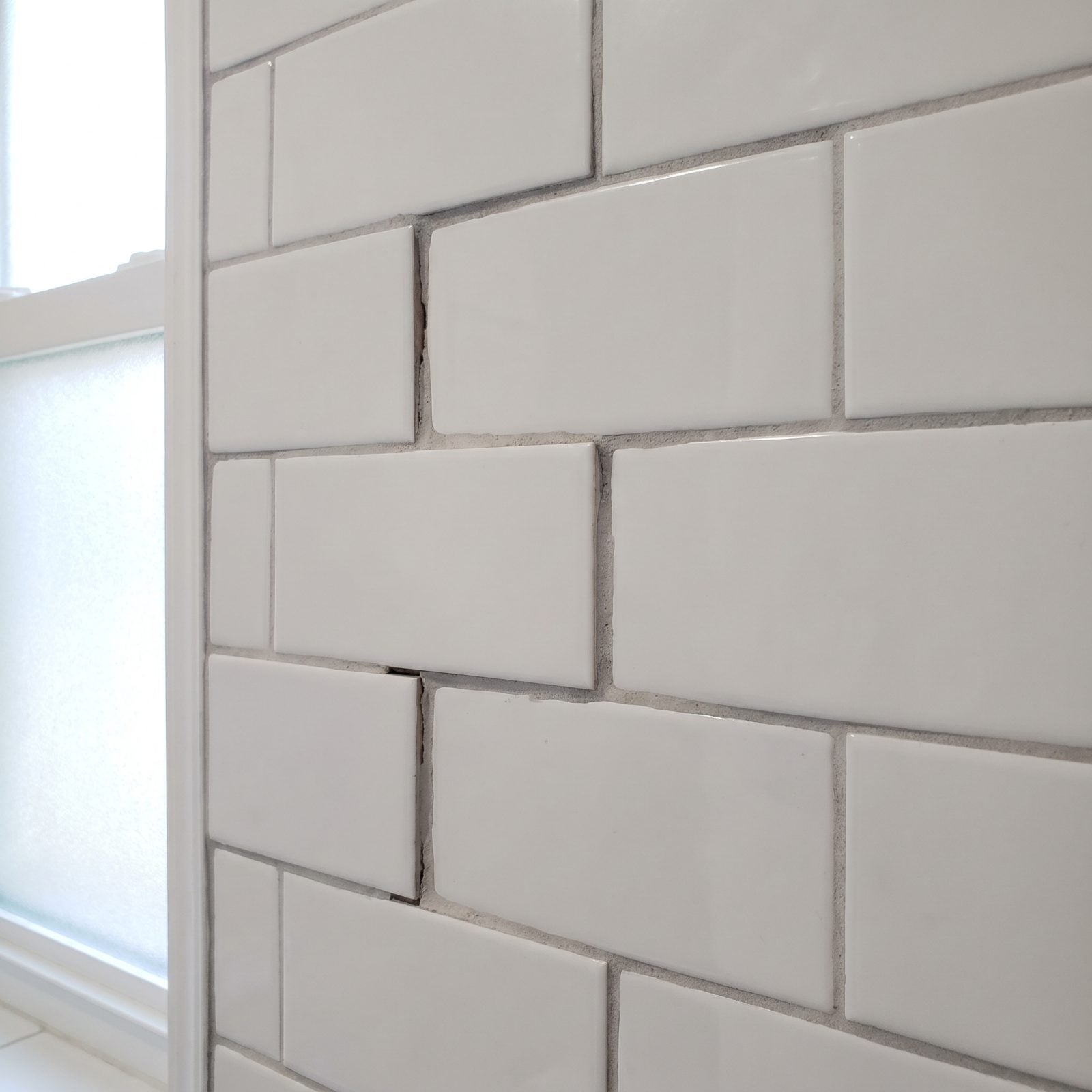 Mismatched Grout Lines in the Bathroom Tile