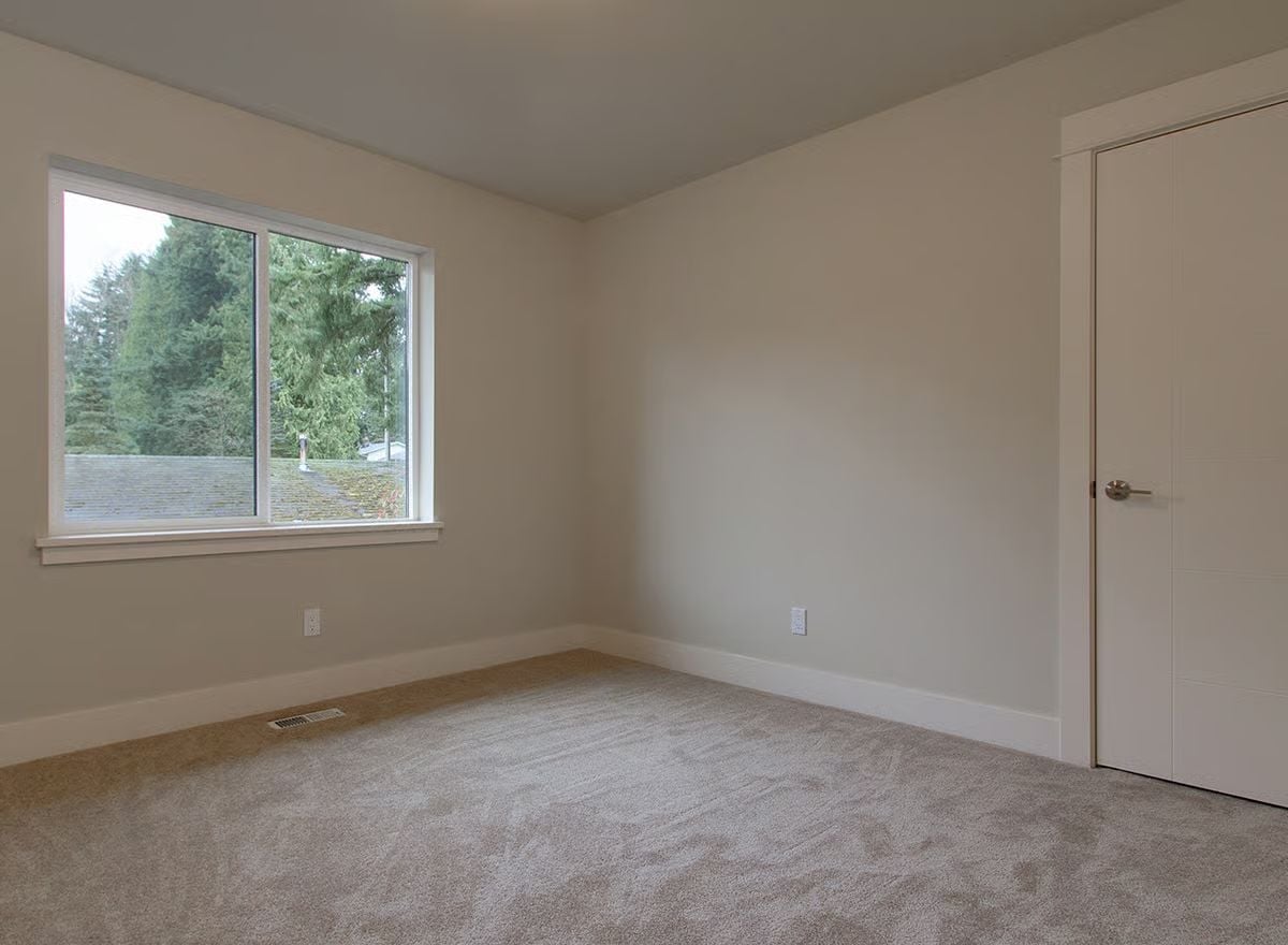 Carpet, Greige Walls, and a Window Worth Sitting Near