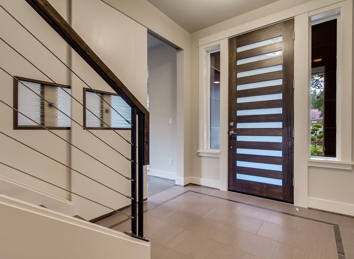 Horizontal Glass Strips Turn a Front Door Into a Privacy Screen That Still Lets Light Win