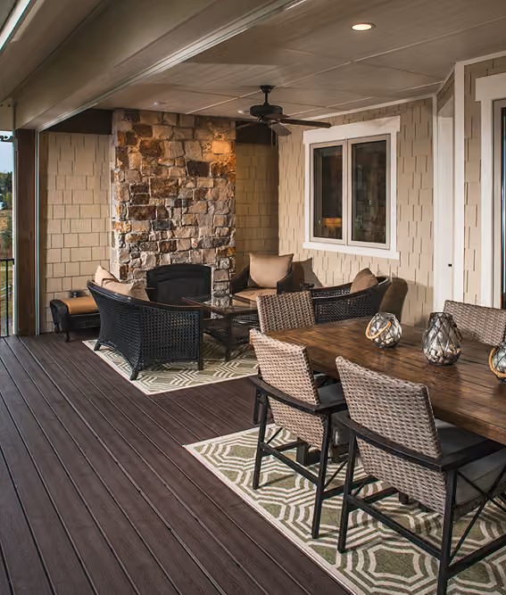 Stone Fireplace, Ceiling Fan, Wicker Chairs: Covered Porch Done Right