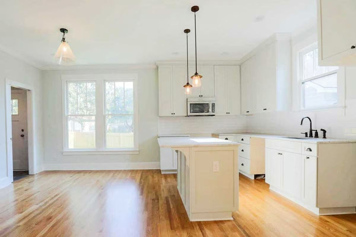 Pendant Lights Do the Heavy Lifting in This White Kitchen