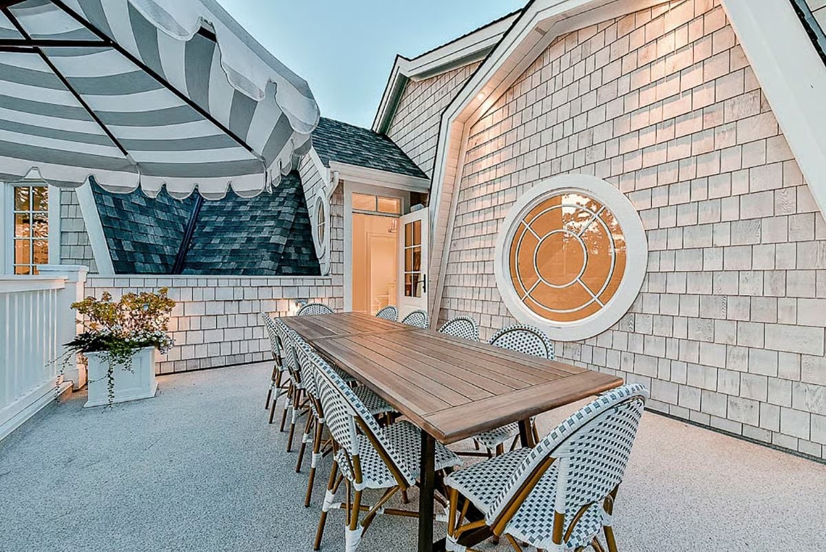 Rooftop Wicker, Round Porthole Glass, and a Table That Seats the Whole Problem