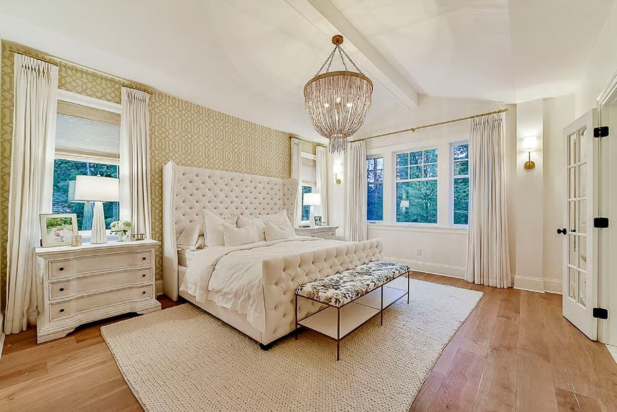 Tufted Velvet, Gold Wallpaper, and a Chandelier Worth the Ceiling Height