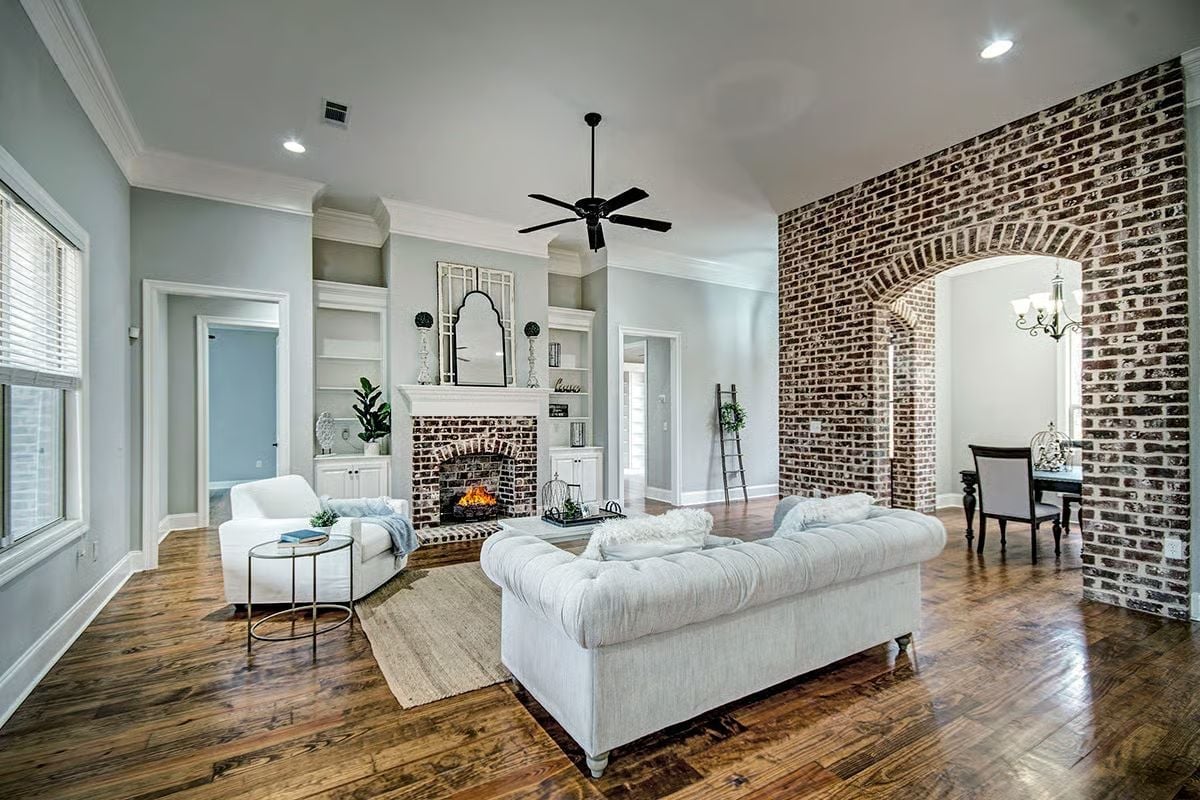 Tufted Chesterfield and Glowing Hearth Make This Living Room Hard to Leave