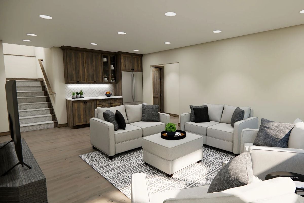 Warm Wood Cabinets and Light Gray Sofas Make This Basement Feel Like the Best Room in the House