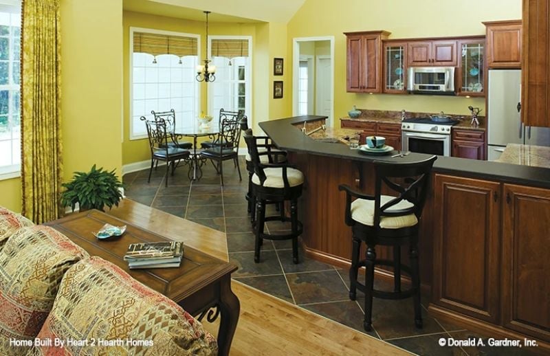 Black Counters, Cherry Cabinets, and a Kitchen Island Built for Lingering