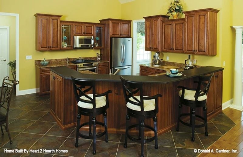 Cherry Cabinets and a Curved Island That Pulls You Into the Kitchen