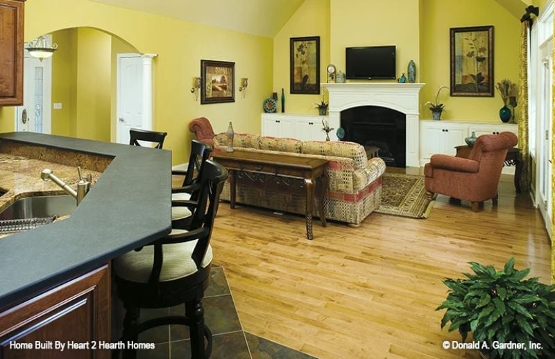 Yellow Walls and Black Counters in an Open-Plan Kitchen That Actually Works