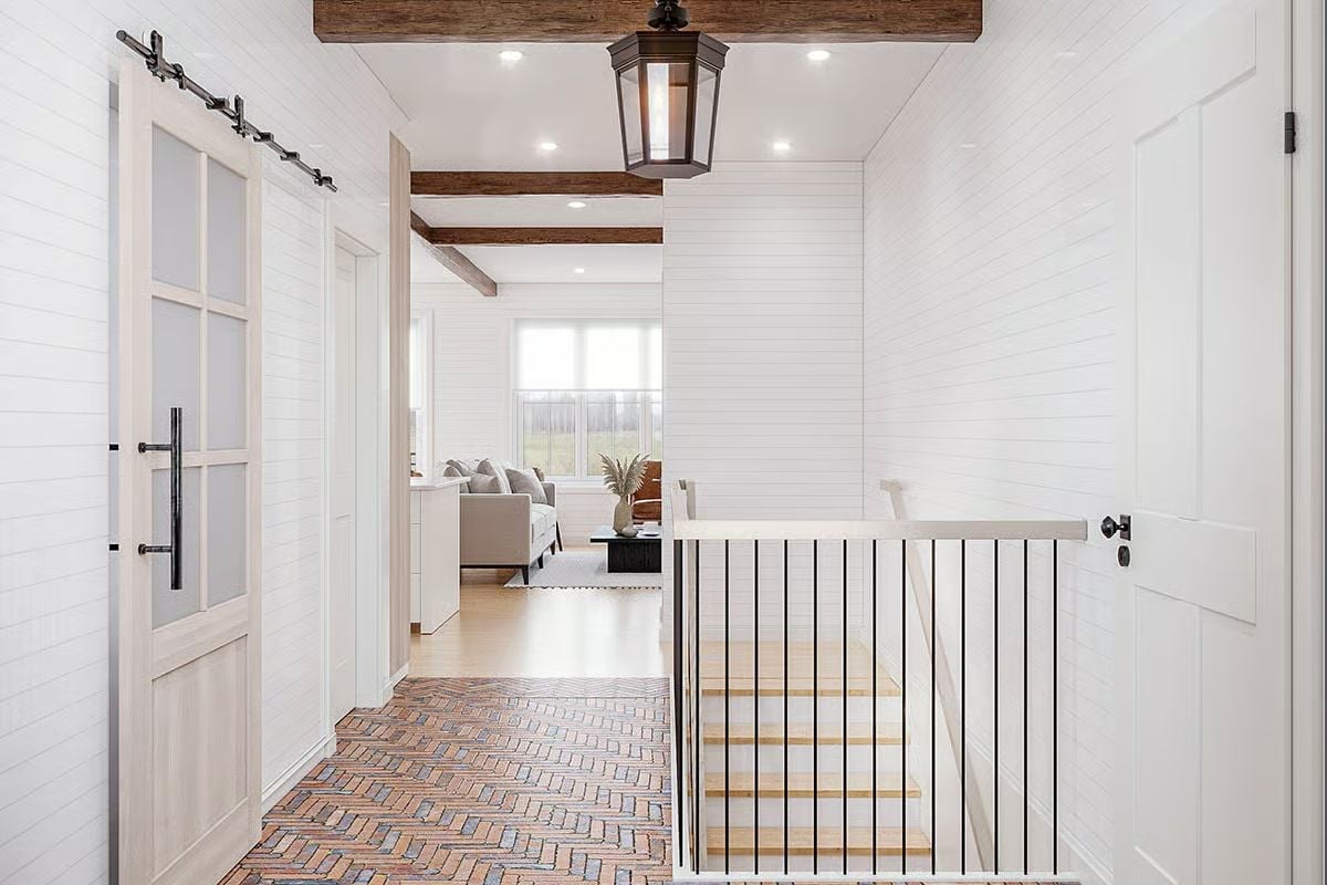 Herringbone Brick on the Floor and a Lantern Overhead Set the Tone Fast
