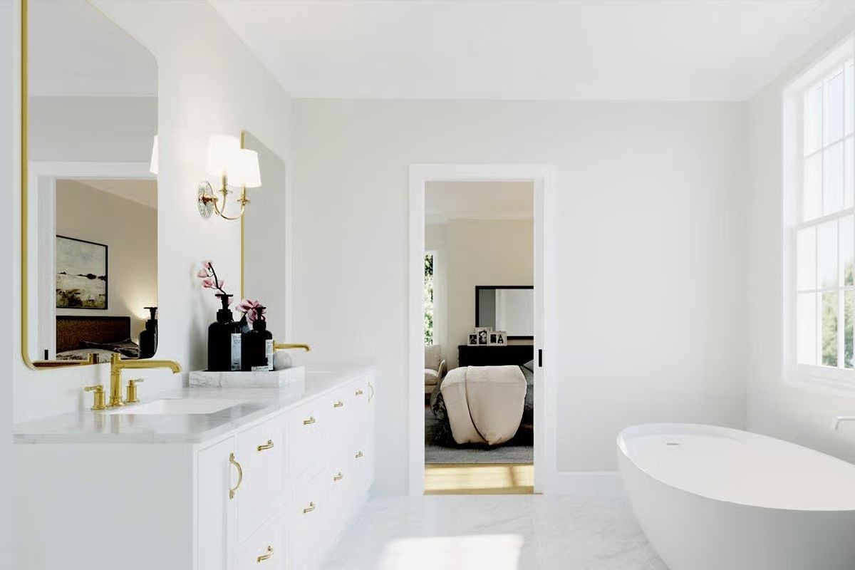 Gold Fixtures and a Freestanding Tub Keep This Primary Bath Effortlessly Calm