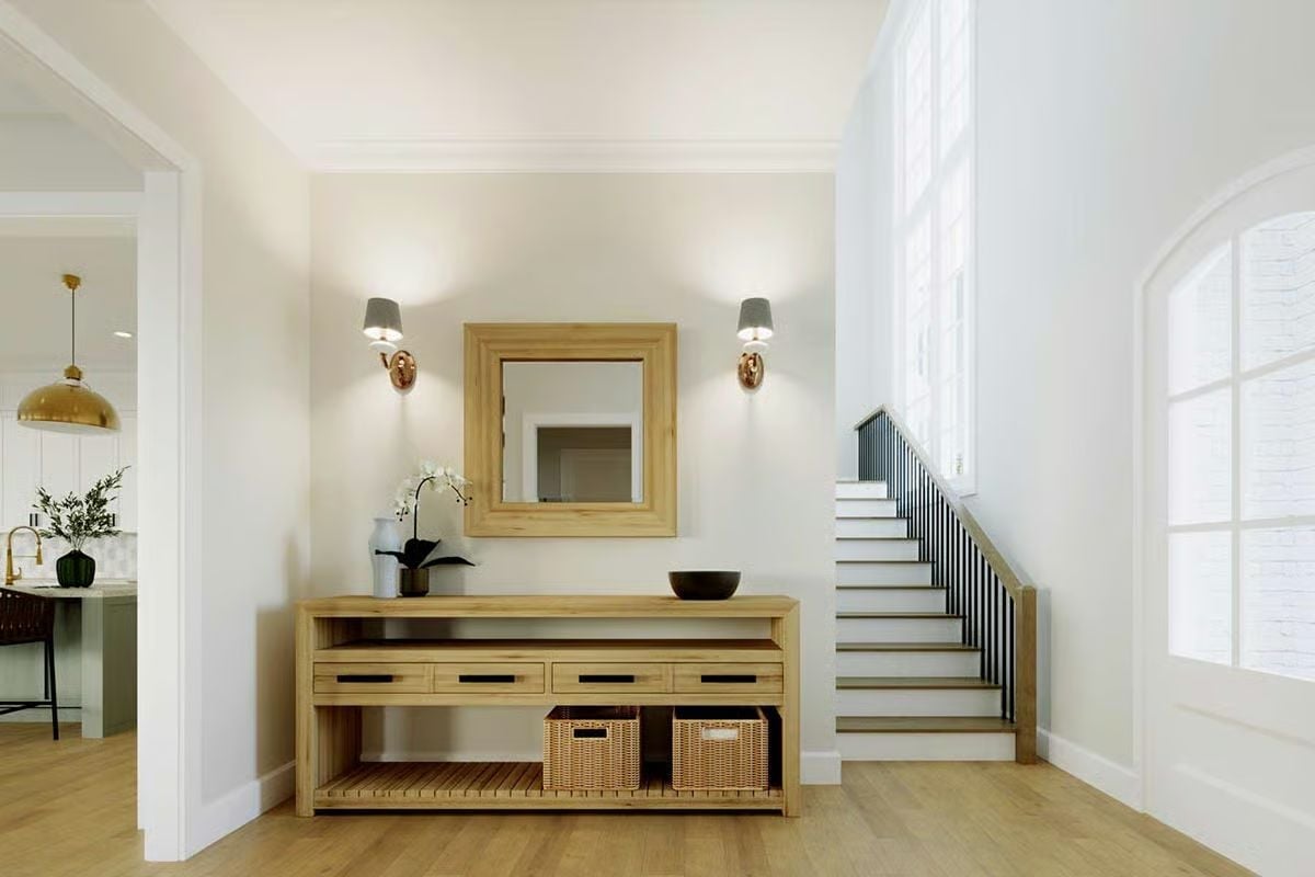 Warm Oak and Wall Sconces Make This Entry Feel Like It Means Something