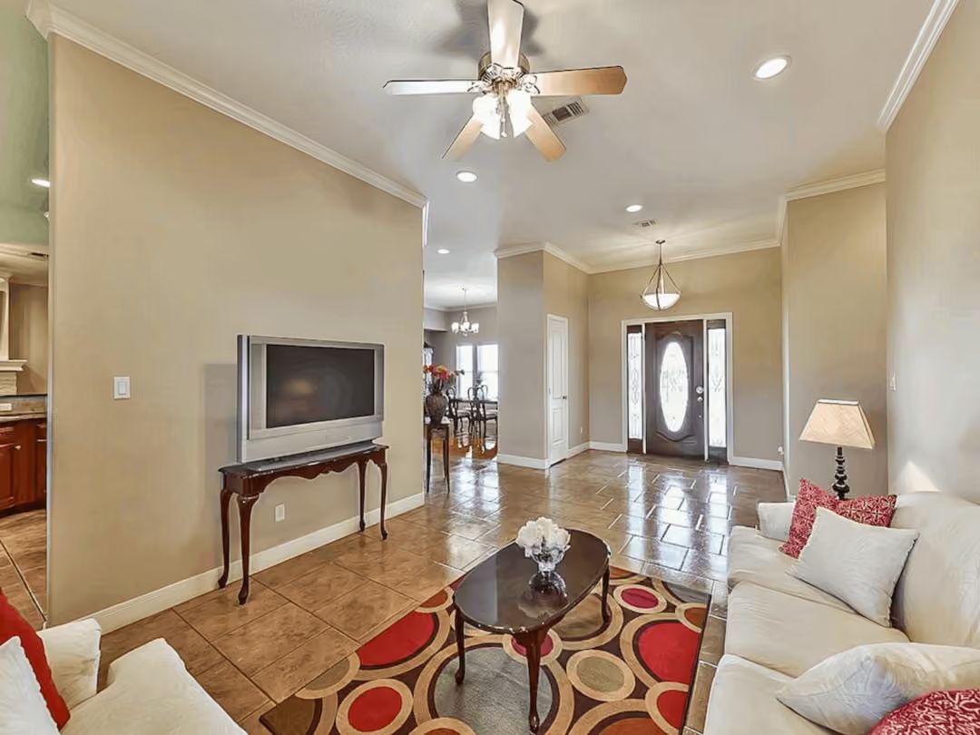 Oval-Door Entry and a Rug That Commits Hard to Red