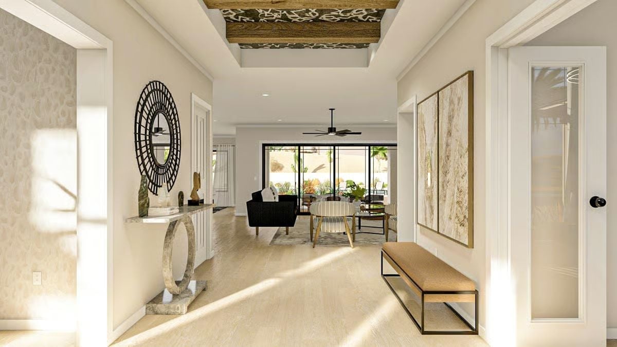 Sunlit Entry Hallway Where the Circular Mirror Does All the Heavy Lifting