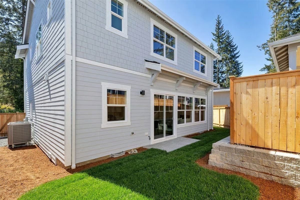 Lap Siding, Sliding Glass, and Fresh Sod That's Still Finding Its Footing