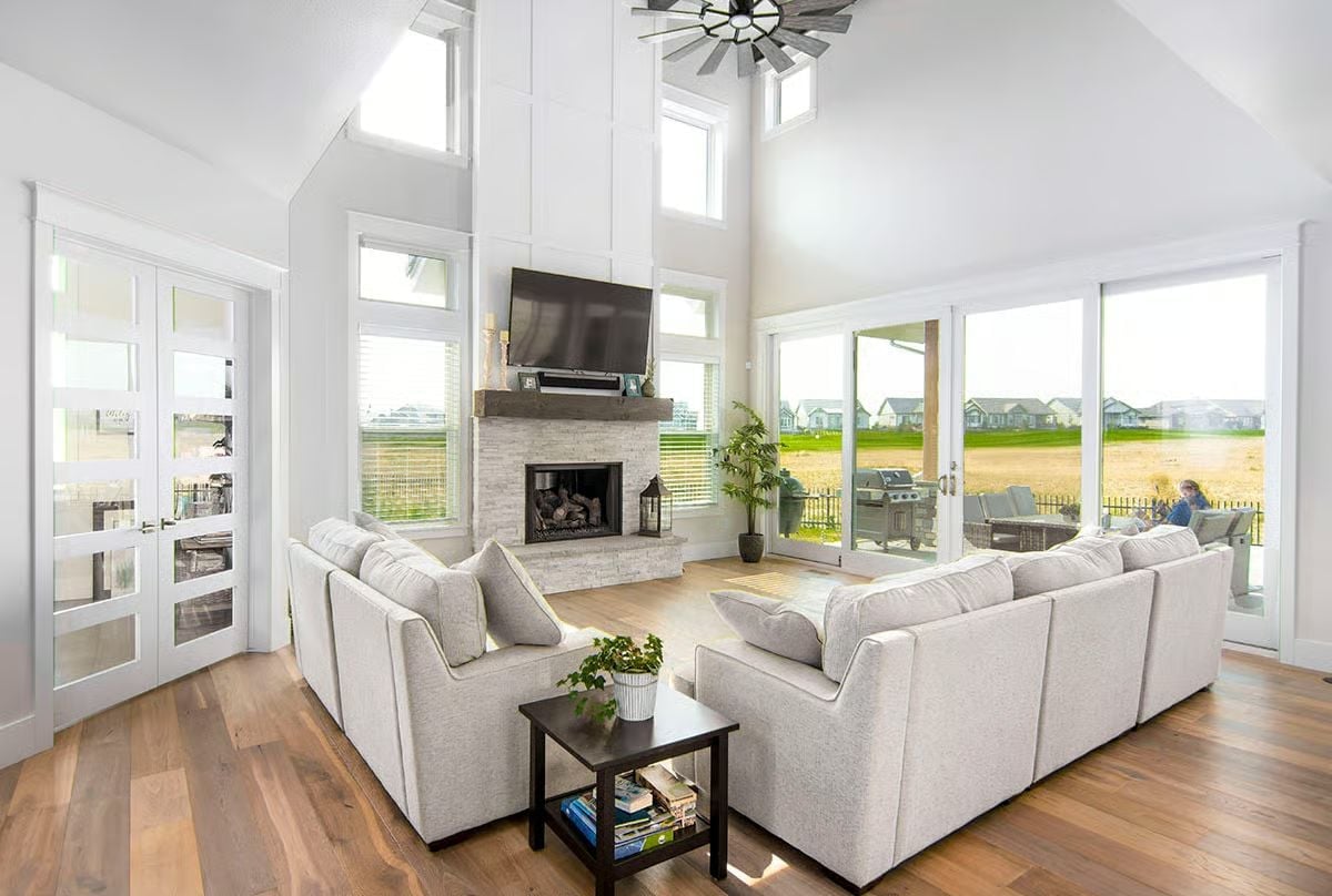 Soaring Ceilings and a Stone Fireplace Make This Great Room Feel Like a Reward