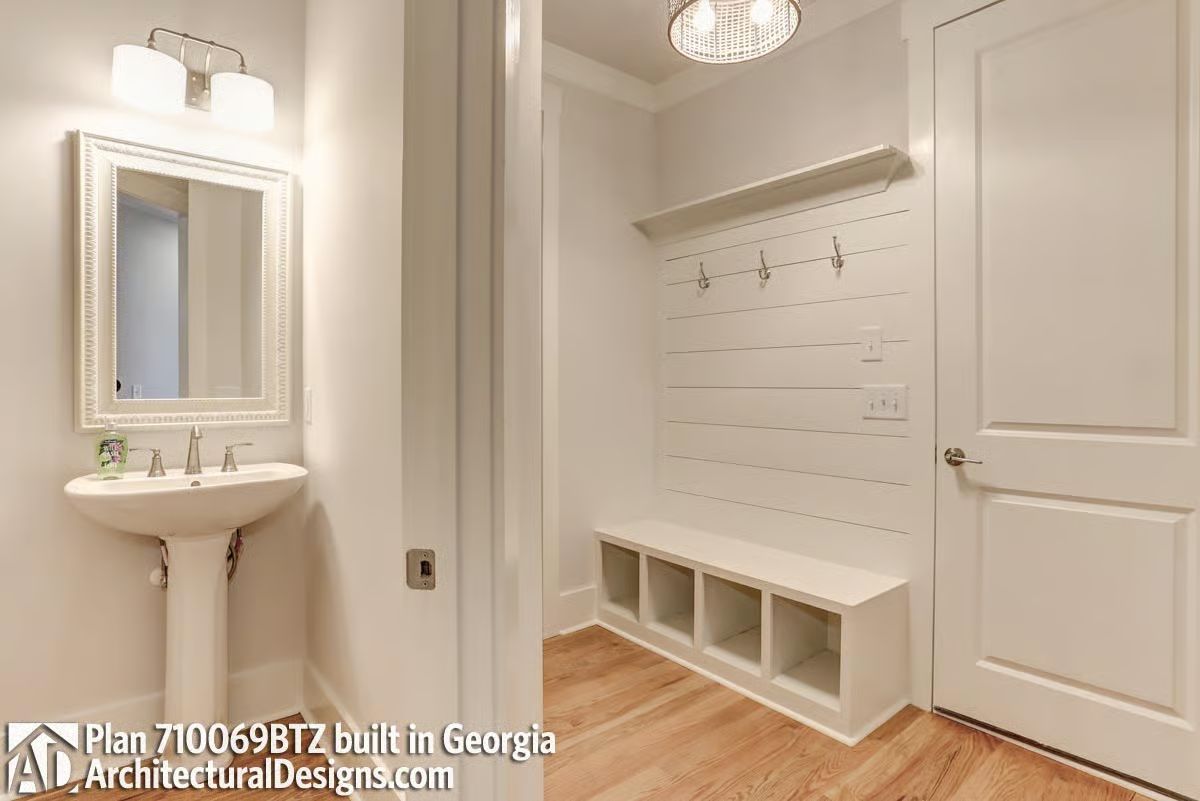 Coat Hooks, a Bench with Cubbies, and a Powder Room Tucked Right Next Door