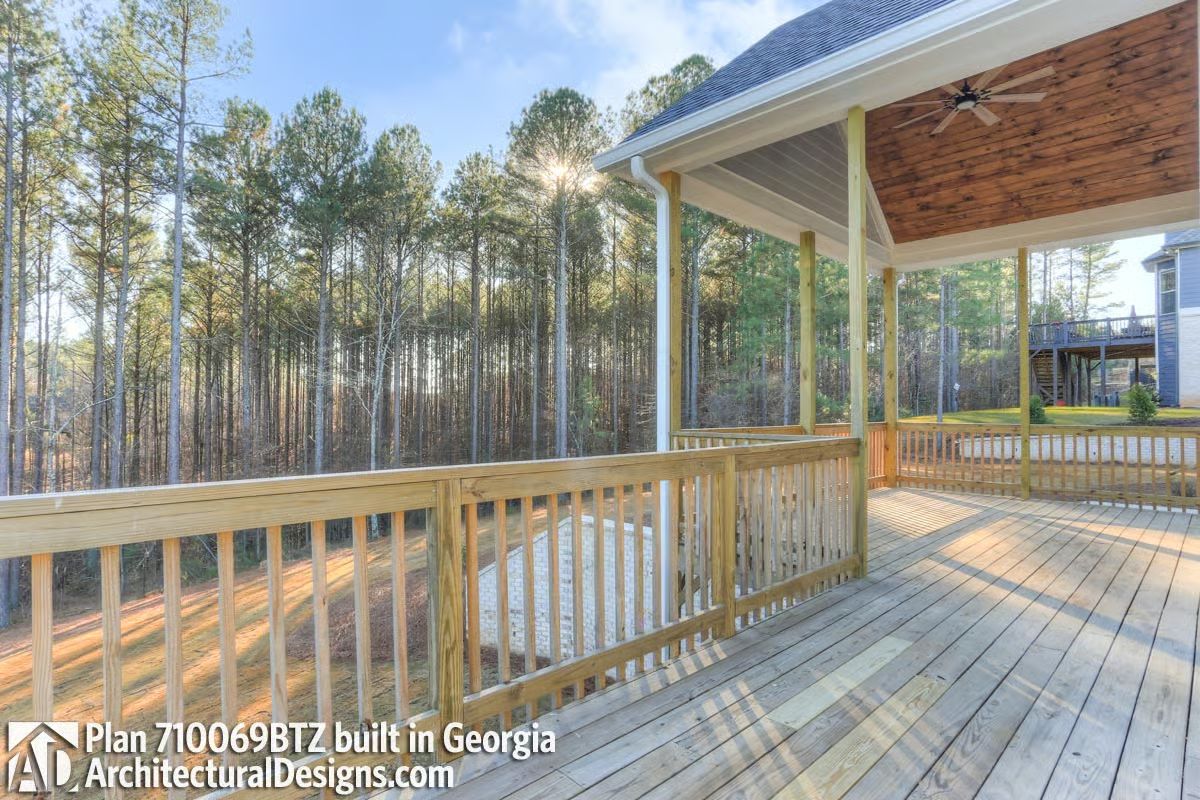 Covered Porch Ceiling With Wood Planks and a Ceiling Fan That Pulls Its Weight