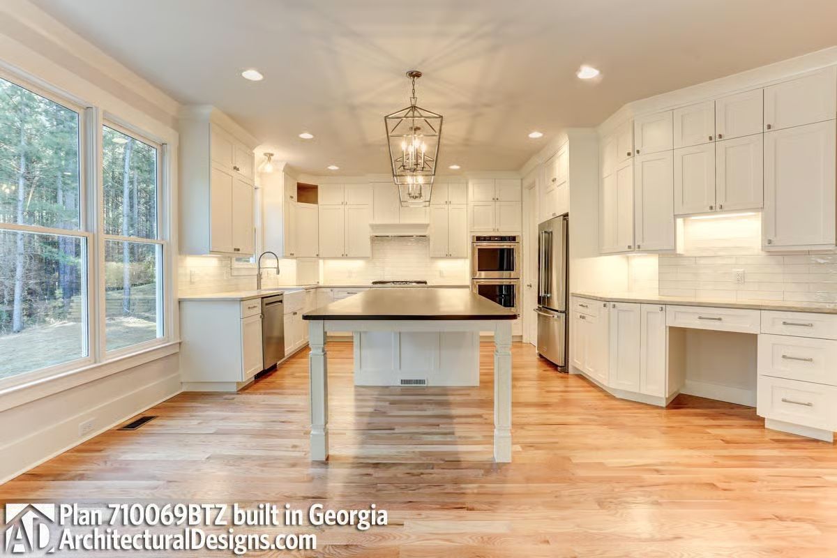 Dark Countertop on a White Island Is a Deliberate Contrast That Actually Works
