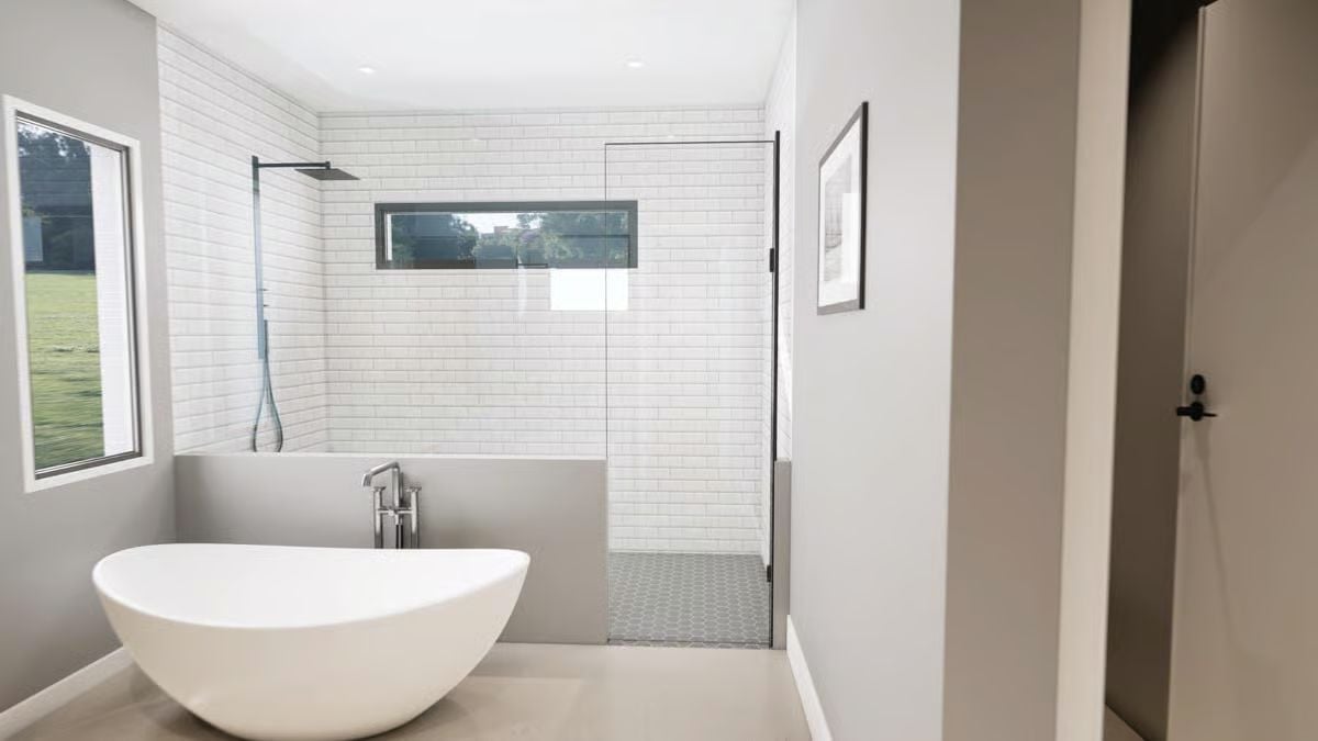 Freestanding Tub, Glass Partition, and Subway Tile That Pulls the Whole Room Together