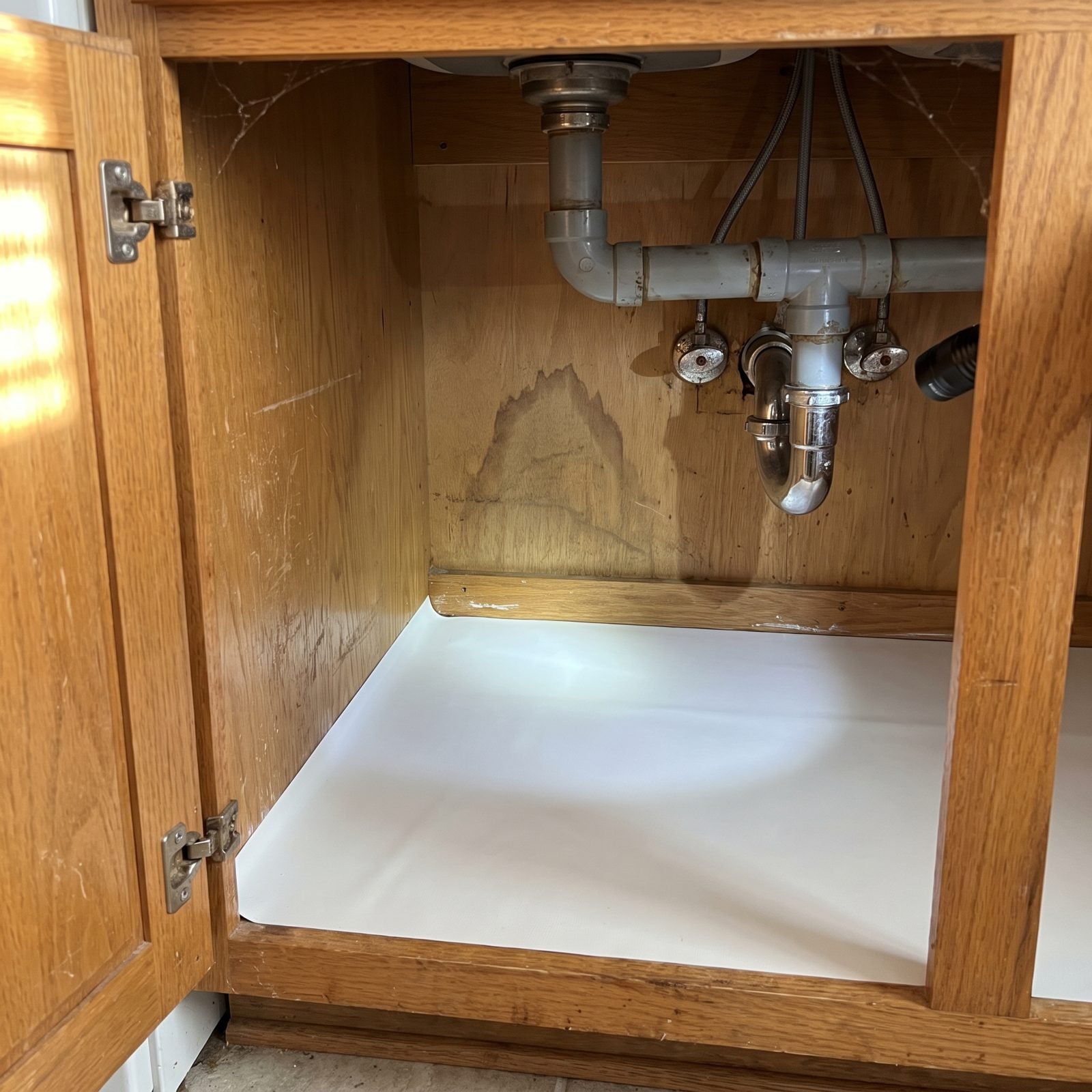 A Pristine Shelf Liner Beneath Just One Sink