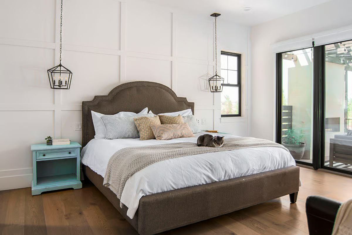 Pendant Lanterns Hung Low Over a Bed That Actually Earns Its Square Footage