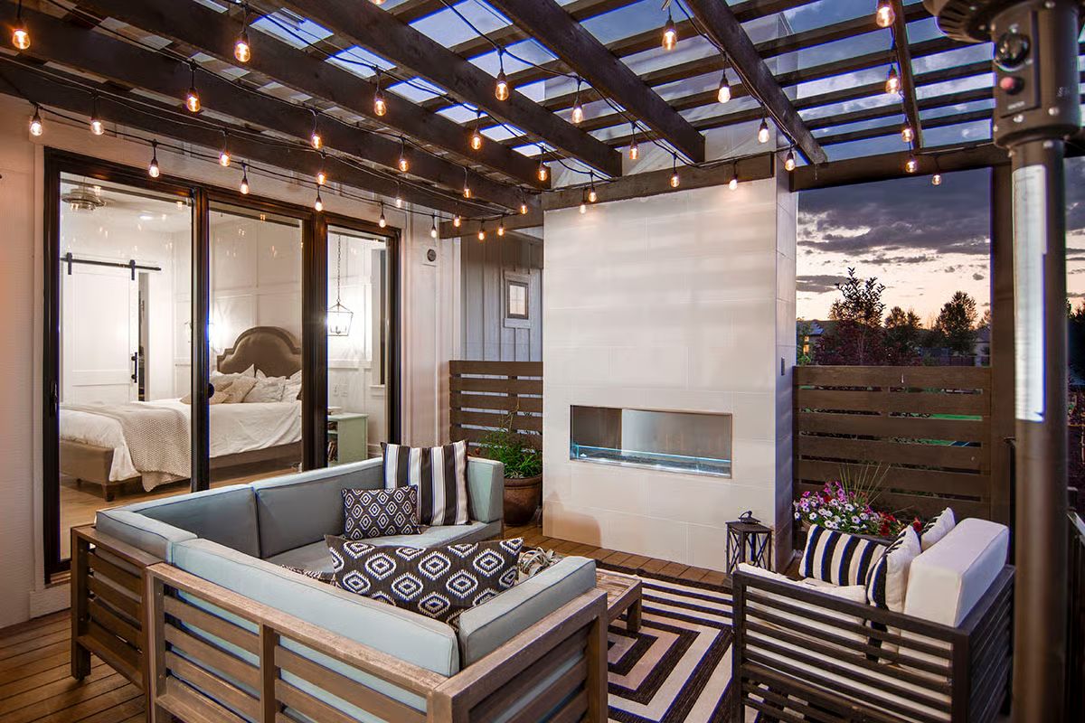 Pergola with a Gas Fireplace Turns an Outdoor Bedroom Patio into a Year-Round Retreat