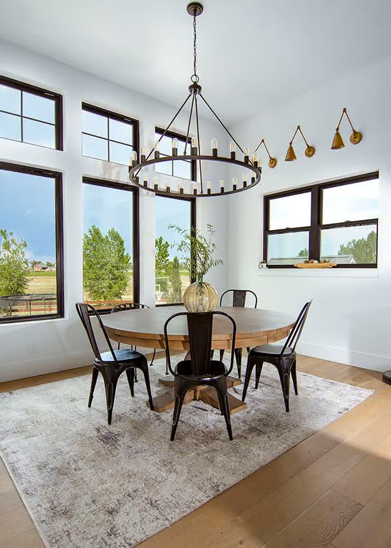 Wagon Wheel Chandelier Anchors a Dining Room Built Around Natural Light