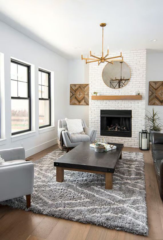 White Brick Fireplace Does the Heavy Lifting in This Modern Farmhouse Living Room