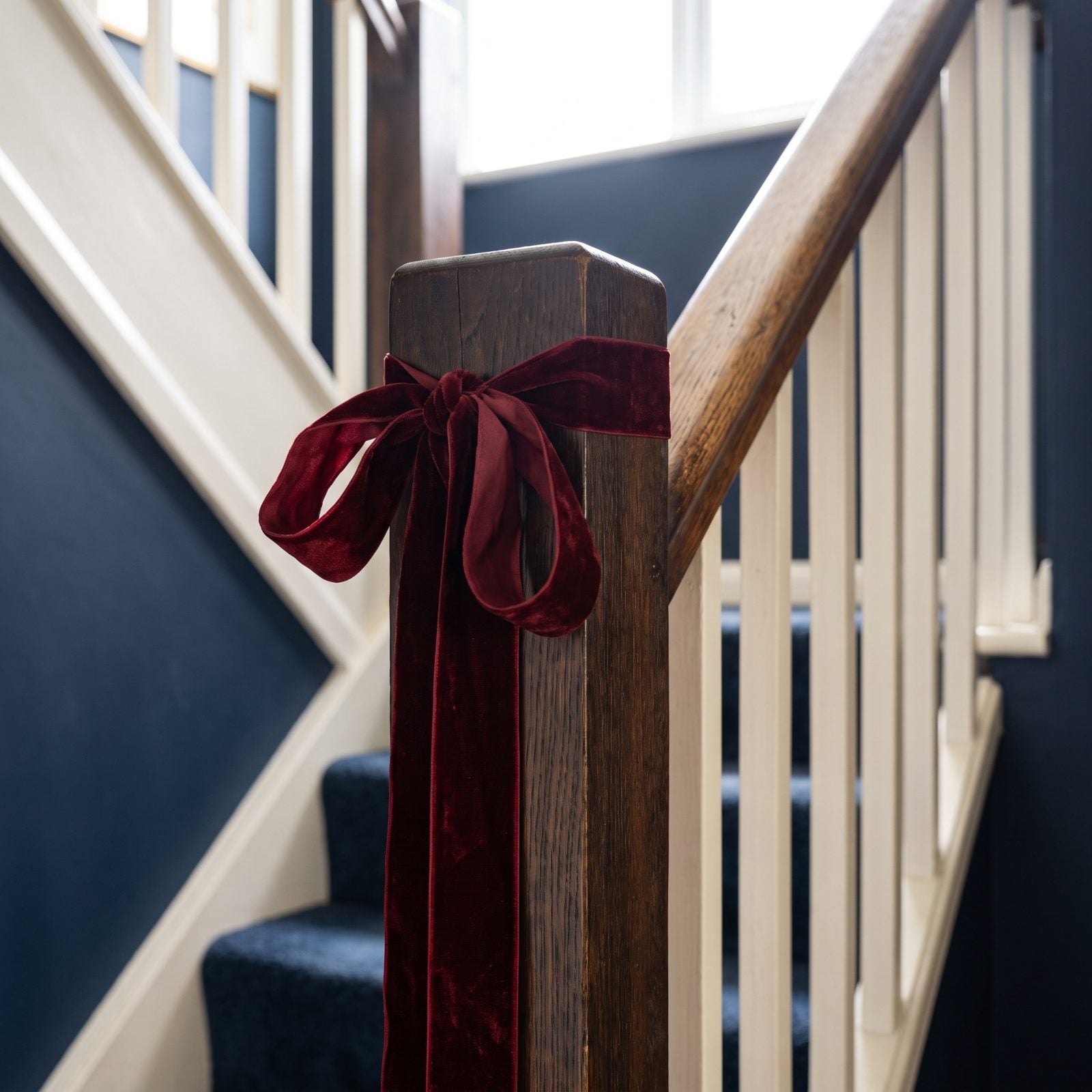 A Red Ribbon Marking the Staircase Newel Post