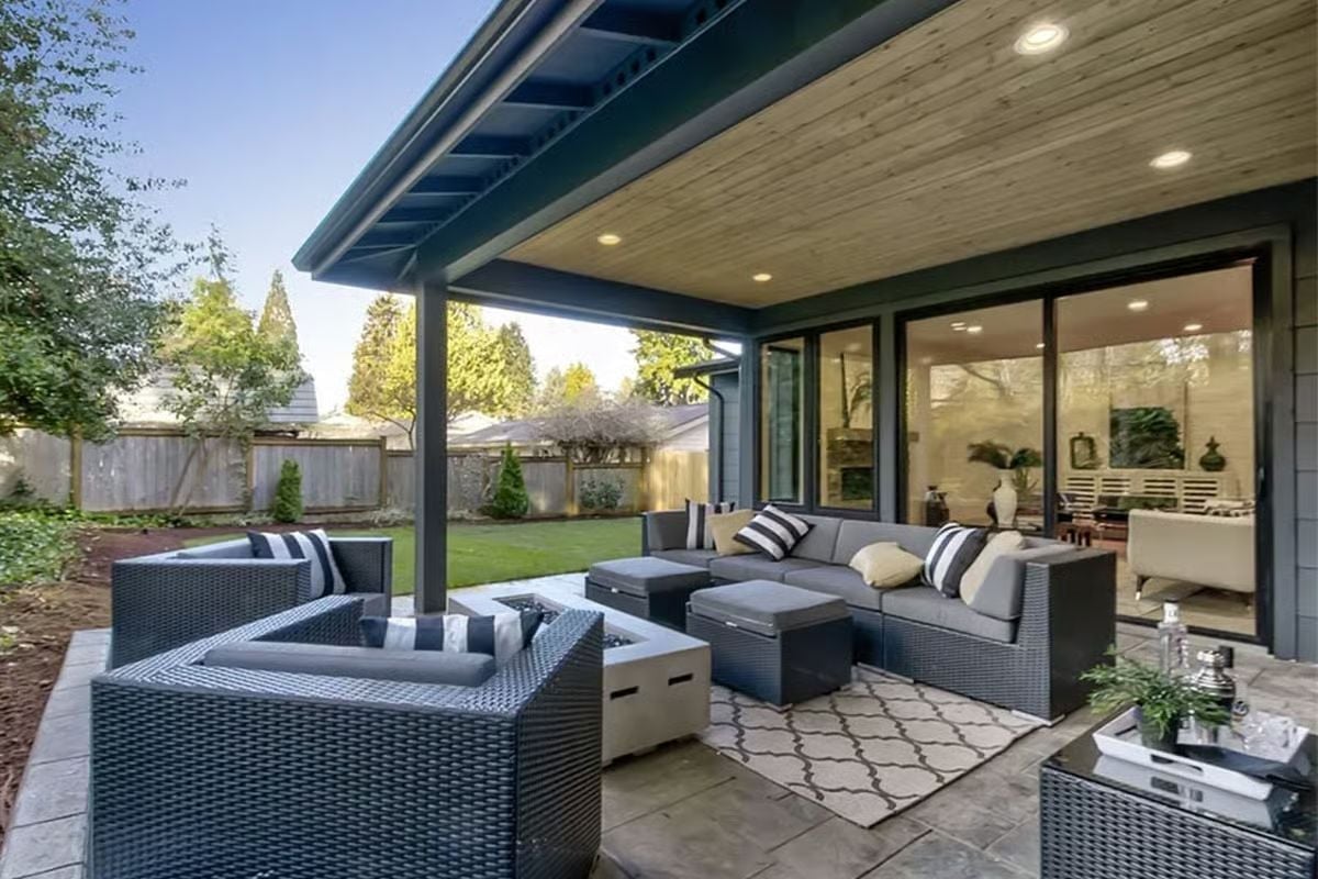 Wicker Furniture and a Fire Table Turn This Covered Patio into a Third Season Room