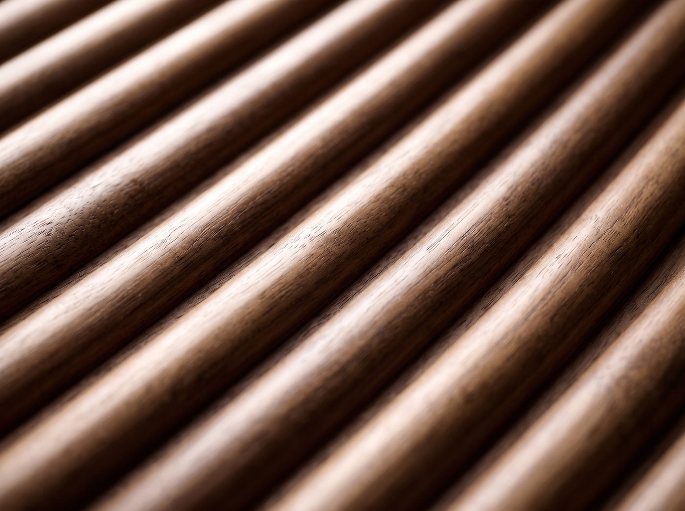 Reeded detail: convex walnut reeds catching the light.