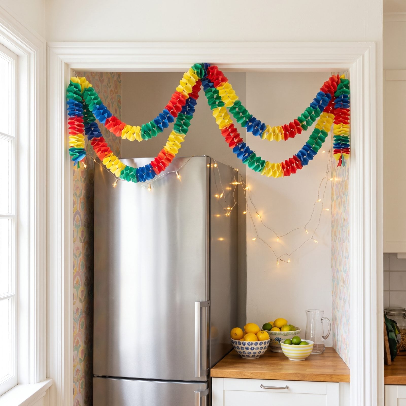 A Refrigerator Alcove Brightened With Paper Garlands