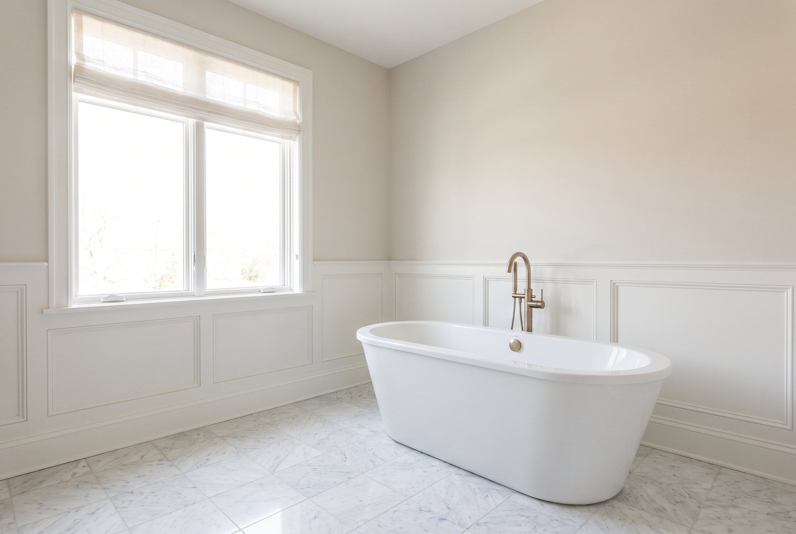 Bathroom with a freestanding tub and wainscot panelling