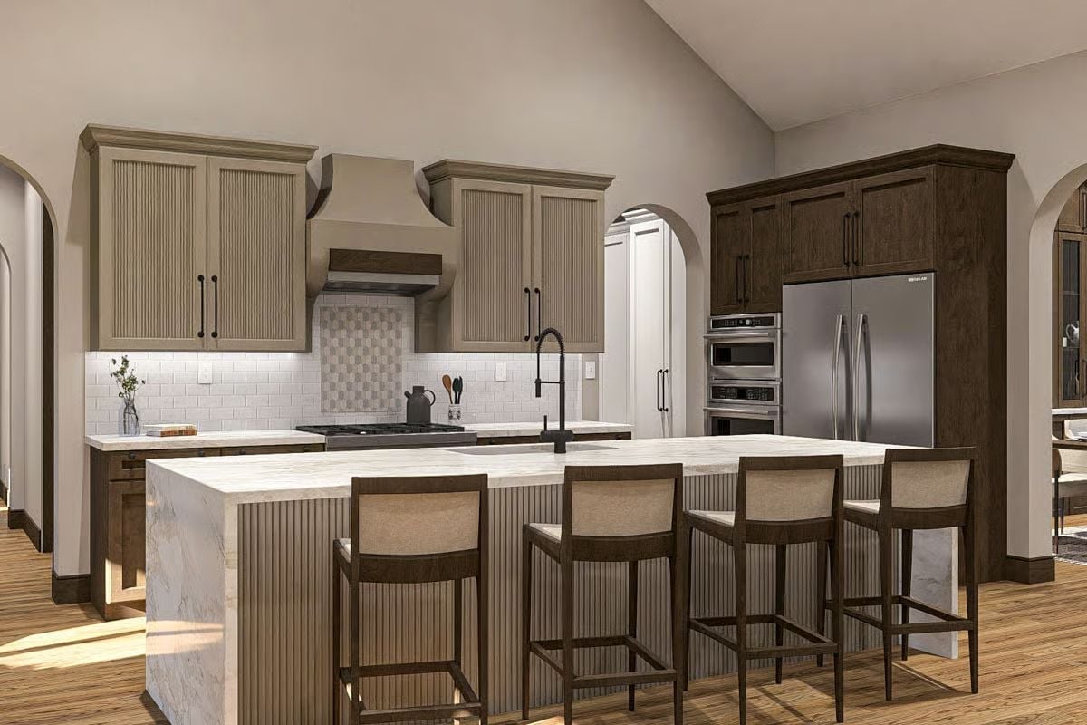 Fluted Island Panels and a Marble Waterfall Edge That Pull the Room Together