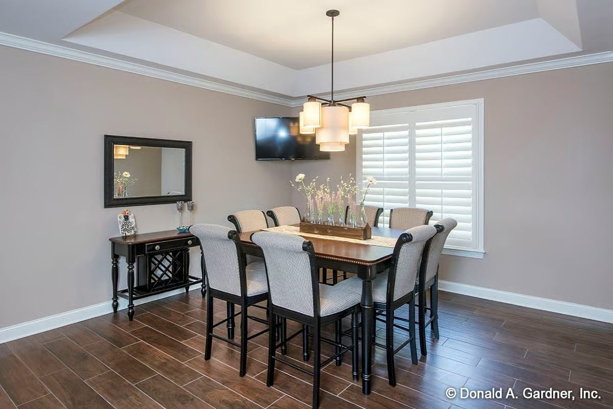 Counter-Height Dining With a TV on the Wall and No Apologies