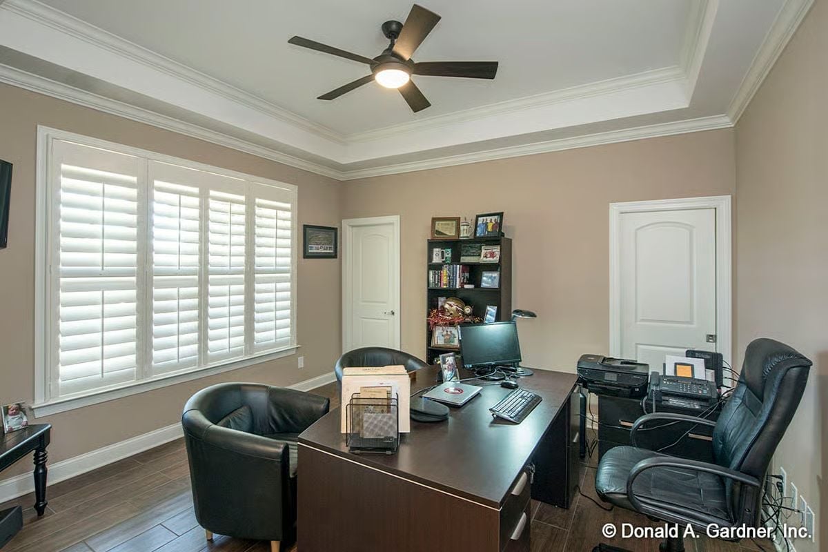 Dark Leather and a Tray Ceiling Make This Home Office Feel Like It Means Business