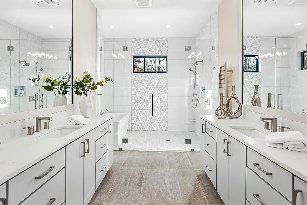 Geometric Accent Tile and Dual Vanities Make This Primary Bath Worth the Square Footage