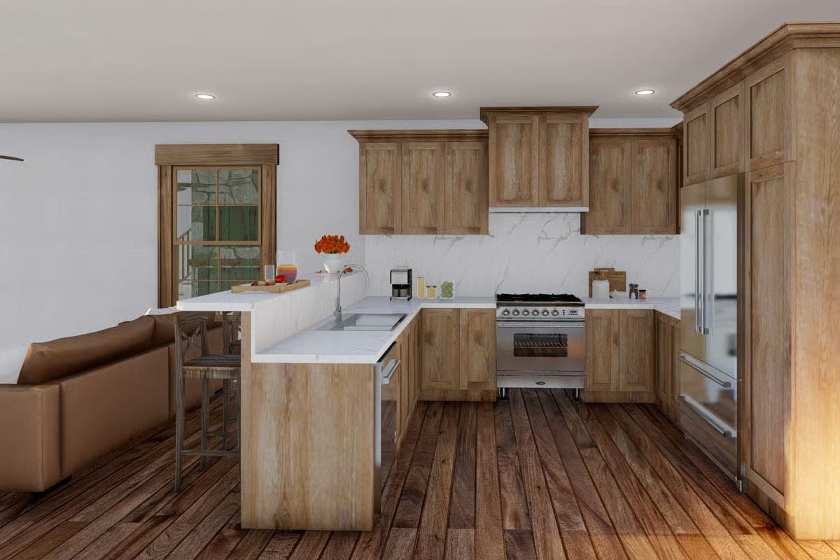 Marble Backsplash and Gas Range in a Kitchen Built for Serious Cooking