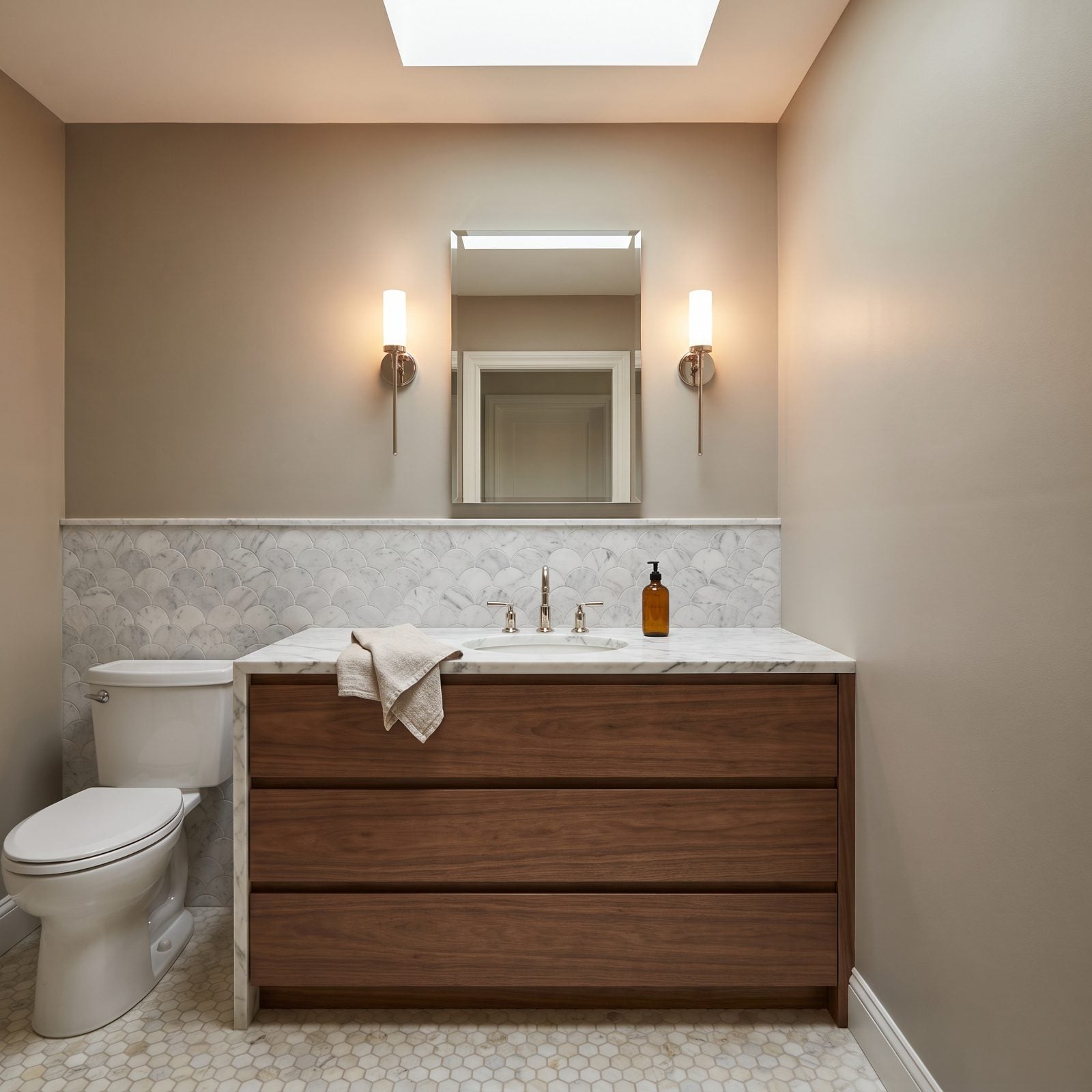 Scalloped Marble Rises Above Flat-Front Walnut Drawers