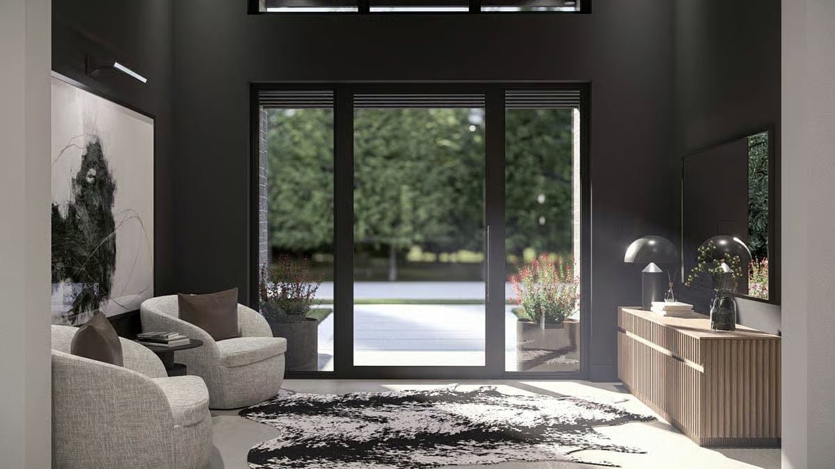 Dark Walls and a Cowhide Rug Make the Glass Do All the Work