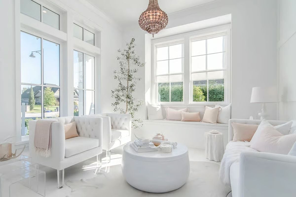 Blush Accents Do Exactly Enough in an All-White Sitting Room