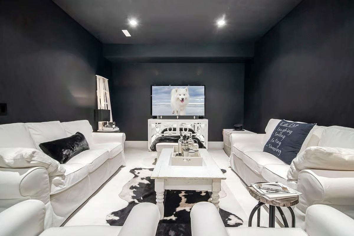Dark Walls, White Sofas, and a TV Room That Actually Gets Used