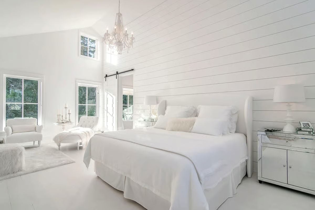 Shiplap Wall, Crystal Chandelier, and a White-on-White Bedroom That Somehow Doesn't Feel Cold